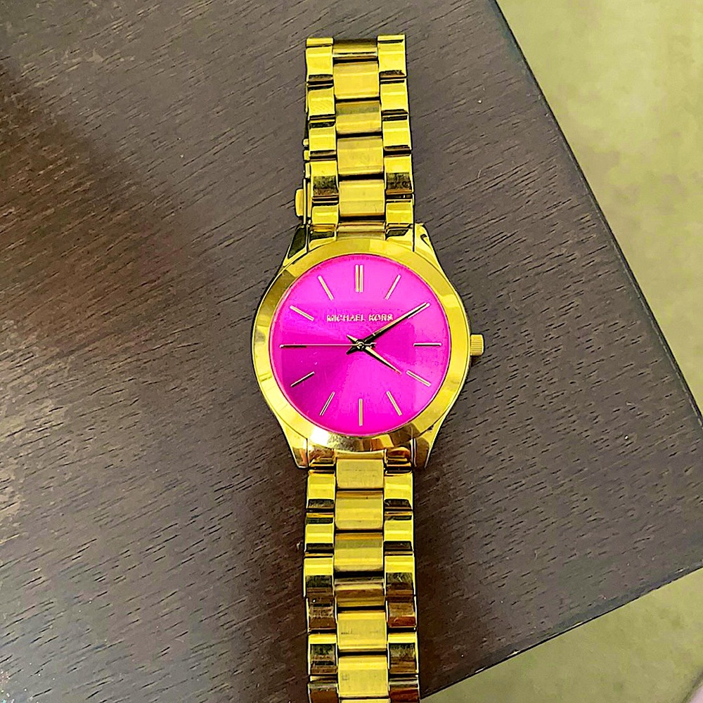 Gold, Micheal Kors watch with a hot pink face!